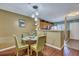 Small dining area with glass top table and four chairs at 7963 Shadow Oak Dr, North Charleston, SC 29406