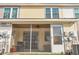 Rear exterior view showing a screened porch and AC unit at 7963 Shadow Oak Dr, North Charleston, SC 29406