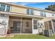 Rear exterior view showing a screened porch and AC unit at 7963 Shadow Oak Dr, North Charleston, SC 29406