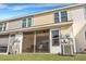 Rear exterior view showing a screened porch and AC unit at 7963 Shadow Oak Dr, North Charleston, SC 29406