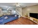 Open concept living room with hardwood floors and two sofas at 7963 Shadow Oak Dr, North Charleston, SC 29406