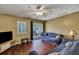 Living room with hardwood floors and sliding glass doors at 7963 Shadow Oak Dr, North Charleston, SC 29406