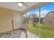 Screened porch with view of backyard and neighboring homes at 7963 Shadow Oak Dr, North Charleston, SC 29406