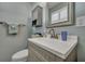 Clean bathroom with a gray vanity, white countertop, and a large mirror at 1022 Margaret Dr, Ladson, SC 29456