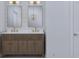Double vanity bathroom with modern fixtures and wood cabinets at 105 Mayfair Ct, Summerville, SC 29485