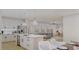 Open concept kitchen with white cabinets and marble island at 105 Mayfair Ct, Summerville, SC 29485