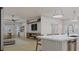 Open concept kitchen with white cabinets and marble island at 105 Mayfair Ct, Summerville, SC 29485
