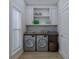 Convenient laundry room with washer, dryer, and overhead cabinets at 105 Mayfair Ct, Summerville, SC 29485