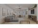 Bright and airy living room with sectional sofa and large windows at 105 Mayfair Ct, Summerville, SC 29485