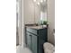 Simple bathroom with dark vanity and tile floors at 111 Crimson St, Summerville, SC 29486