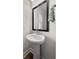 Small bathroom with pedestal sink and mirror at 111 Crimson St, Summerville, SC 29486
