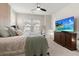 Comfortable bedroom with a king-size bed and large TV at 111 Crimson St, Summerville, SC 29486