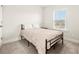 Cozy bedroom with a full-size bed and ample natural light at 111 Crimson St, Summerville, SC 29486