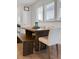 Farmhouse-style dining table with bench seating in bright, airy space at 111 Crimson St, Summerville, SC 29486
