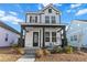 Two-story home with white siding, black accents, and a welcoming front porch at 111 Crimson St, Summerville, SC 29486