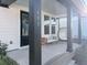 Welcoming front porch features a sitting area and hanging chair at 111 Crimson St, Summerville, SC 29486