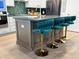 Kitchen island with dark countertops and three green velvet barstools at 111 Crimson St, Summerville, SC 29486