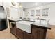 Modern farmhouse kitchen sink with gold faucet and dark countertop at 111 Crimson St, Summerville, SC 29486
