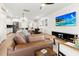 Open living space with leather couch and large TV at 111 Crimson St, Summerville, SC 29486