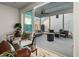 Relaxing screened porch with seating area and fire pit, accessible from the living room at 111 Crimson St, Summerville, SC 29486