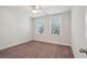 Bright bedroom with two windows and ceiling fan at 1216 Ashley Hall Rd, Charleston, SC 29407