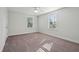 Well-lit bedroom featuring neutral walls and carpet at 1216 Ashley Hall Rd, Charleston, SC 29407