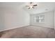 Spacious bedroom with neutral carpeting and a ceiling fan at 1216 Ashley Hall Rd, Charleston, SC 29407