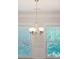 Elegant chandelier with six lights in dining room at 1216 Ashley Hall Rd, Charleston, SC 29407
