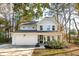 Two-story light blue house with white garage and landscaping at 1216 Ashley Hall Rd, Charleston, SC 29407