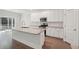 Modern kitchen with white cabinets, granite counters, and stainless steel appliances at 1216 Ashley Hall Rd, Charleston, SC 29407