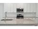 Modern kitchen with white cabinets, granite countertops and stainless steel appliances at 1216 Ashley Hall Rd, Charleston, SC 29407