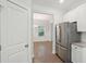 Kitchen with stainless steel refrigerator and access to dining room at 1216 Ashley Hall Rd, Charleston, SC 29407