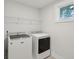Laundry room with washer, dryer, and shelving at 1216 Ashley Hall Rd, Charleston, SC 29407