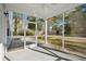 Relaxing screened porch overlooks a fenced backyard at 1216 Ashley Hall Rd, Charleston, SC 29407