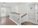 Upstairs hall with hardwood floors and white railings at 1216 Ashley Hall Rd, Charleston, SC 29407