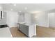 Open concept kitchen features island and hardwood floors at 112 Threaded Fern St, Summerville, SC 29485