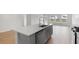 Kitchen island with sink, dishwasher, and view to backyard at 112 Threaded Fern St, Summerville, SC 29485