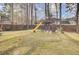 Large backyard with treehouse, playset and wooden fence at 125 Trickle Dr, Summerville, SC 29483
