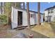 White shed with double doors and window shutters at 125 Trickle Dr, Summerville, SC 29483