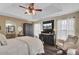 Spacious main bedroom with king-size bed, large windows, and a ceiling fan at 125 Trickle Dr, Summerville, SC 29483