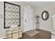 Entryway with an ornate wall decor, white door, and hardwood floors at 125 Trickle Dr, Summerville, SC 29483