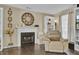 Fireplace with white mantel and decorative clock above at 125 Trickle Dr, Summerville, SC 29483