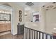 Upstairs hallway with access to bathroom and bedroom, dark wood accents at 125 Trickle Dr, Summerville, SC 29483