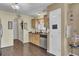 Kitchen with light wood cabinets, stainless steel dishwasher, and a window overlooking backyard at 125 Trickle Dr, Summerville, SC 29483