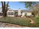 Landscaped backyard with patio and sunroom at 1308 Lexington Dr, Mount Pleasant, SC 29466