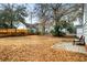Fenced backyard with a patio and mature trees at 1343 E Montague Ave, North Charleston, SC 29405