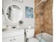 Clean bathroom, white vanity, and beige tile shower at 1343 E Montague Ave, North Charleston, SC 29405