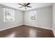 Simple bedroom with ceiling fan and hardwood floors at 1343 E Montague Ave, North Charleston, SC 29405