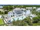 Aerial view of large luxury home overlooking private pool and outdoor lounge area at 1474 Mizzen Aly, Johns Island, SC 29455