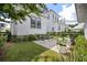 Charming backyard with outdoor seating, green grass, and manicured landscaping at 1474 Mizzen Aly, Johns Island, SC 29455